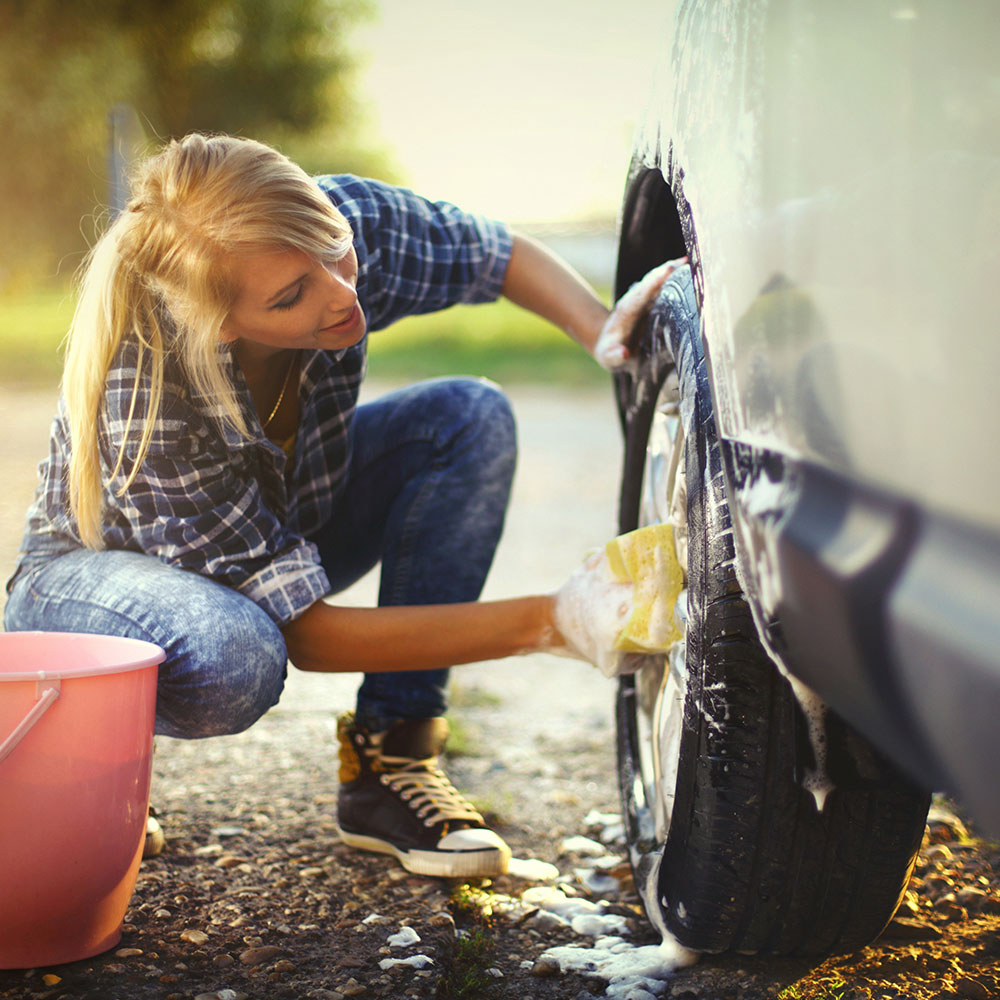 Woman washing car