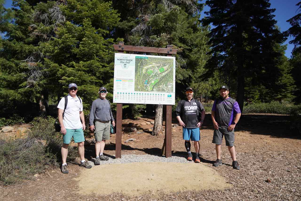 People playing disc golf