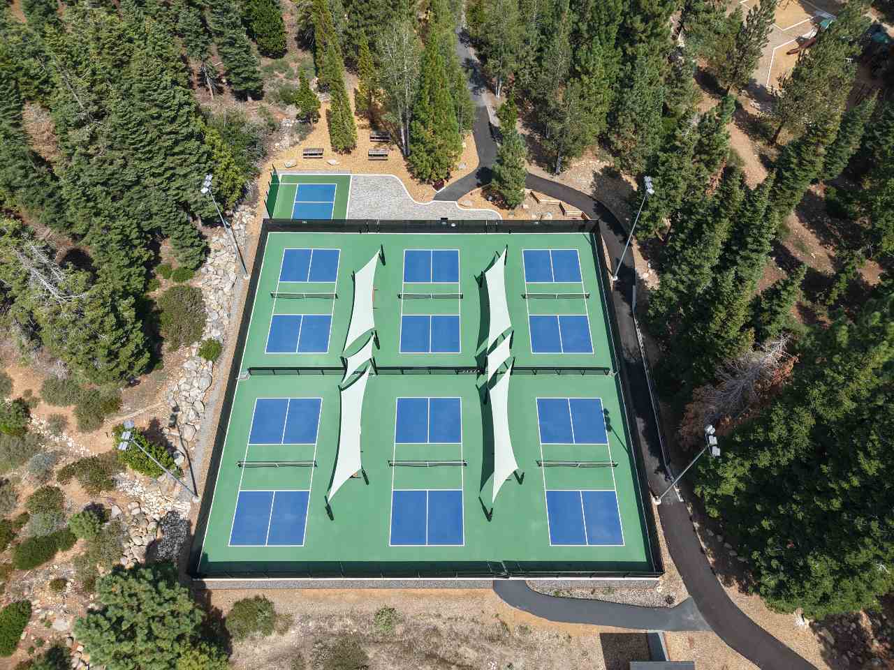 zoomed out aerial view of pickleball plaza and pickleball courts
