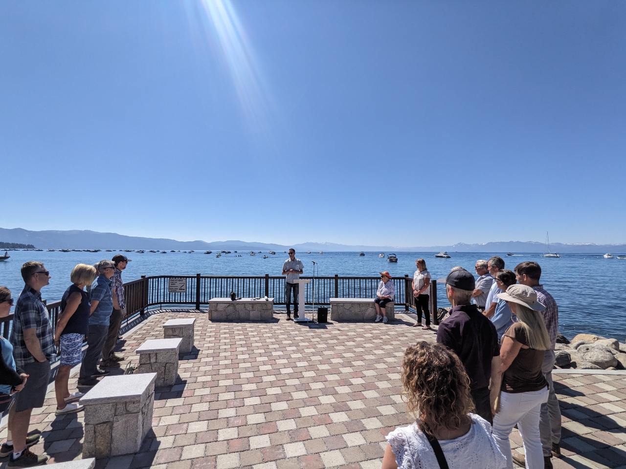 people gathered for a ceremony at the scenic overlook