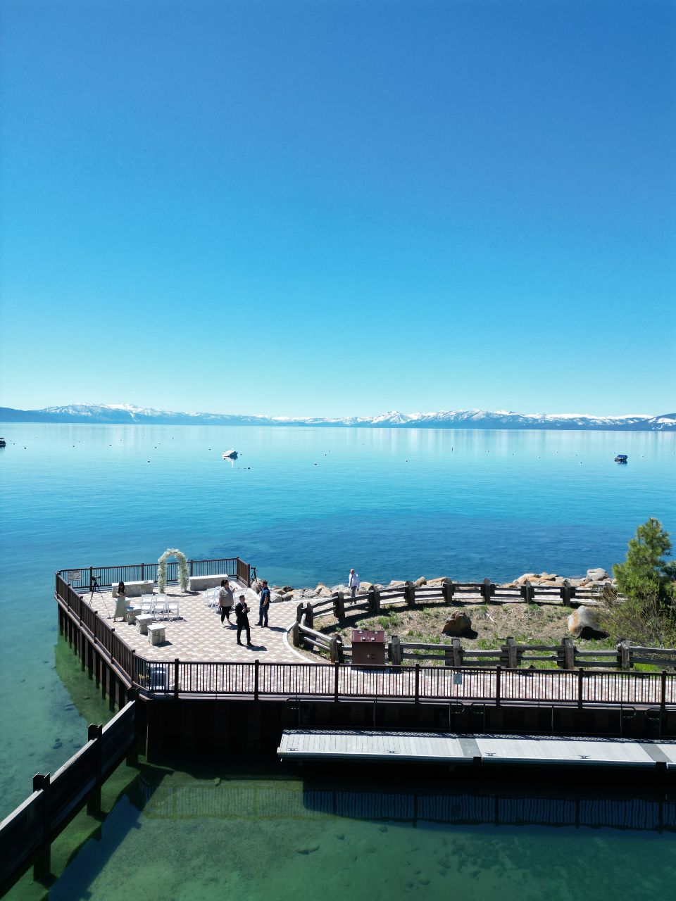 wide view of scenic overlook set up as a ceremony space on Lake Tahoe's blue waters